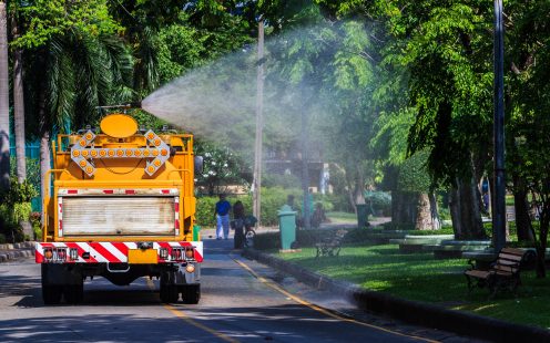 A truck with water tank irrigates plants growing near the street | Pipelife